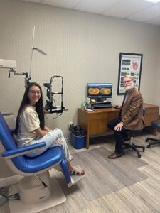 Doctor Chism and patient in exam room.