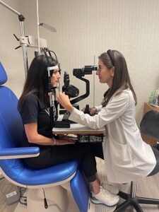 Dr. Marshall performing eye exam.